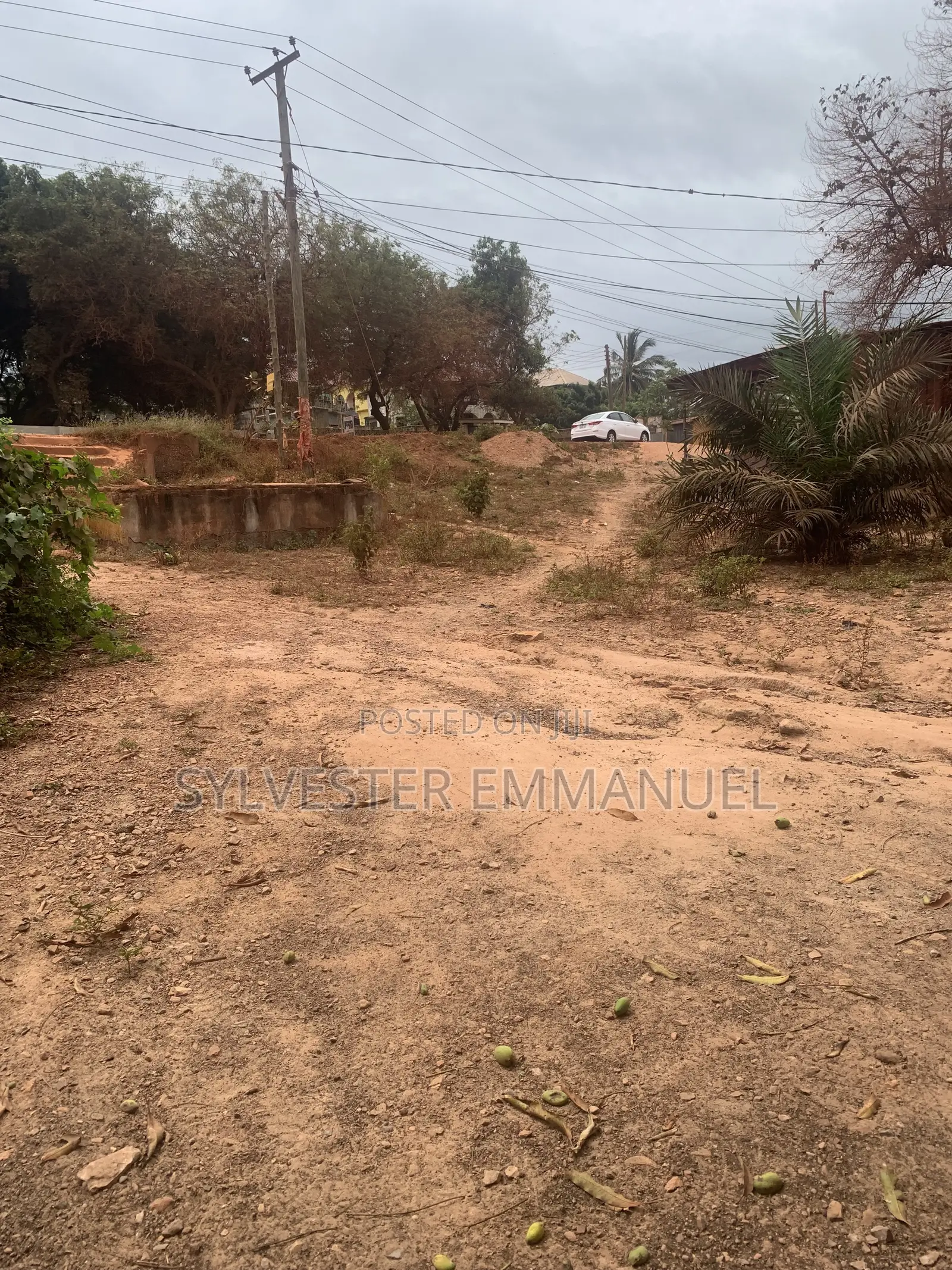 A Plot of Land (70/100 ) at Aplaku on a Roadside With a Building