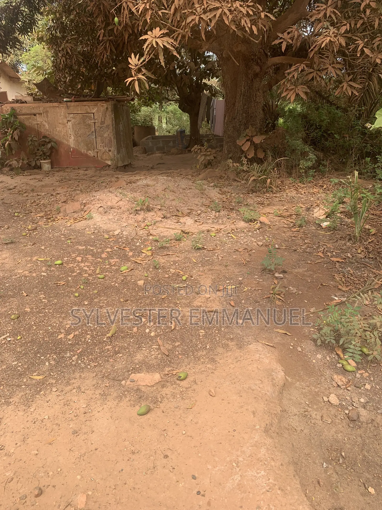 A Plot of Land (70/100 ) at Aplaku on a Roadside With a Building