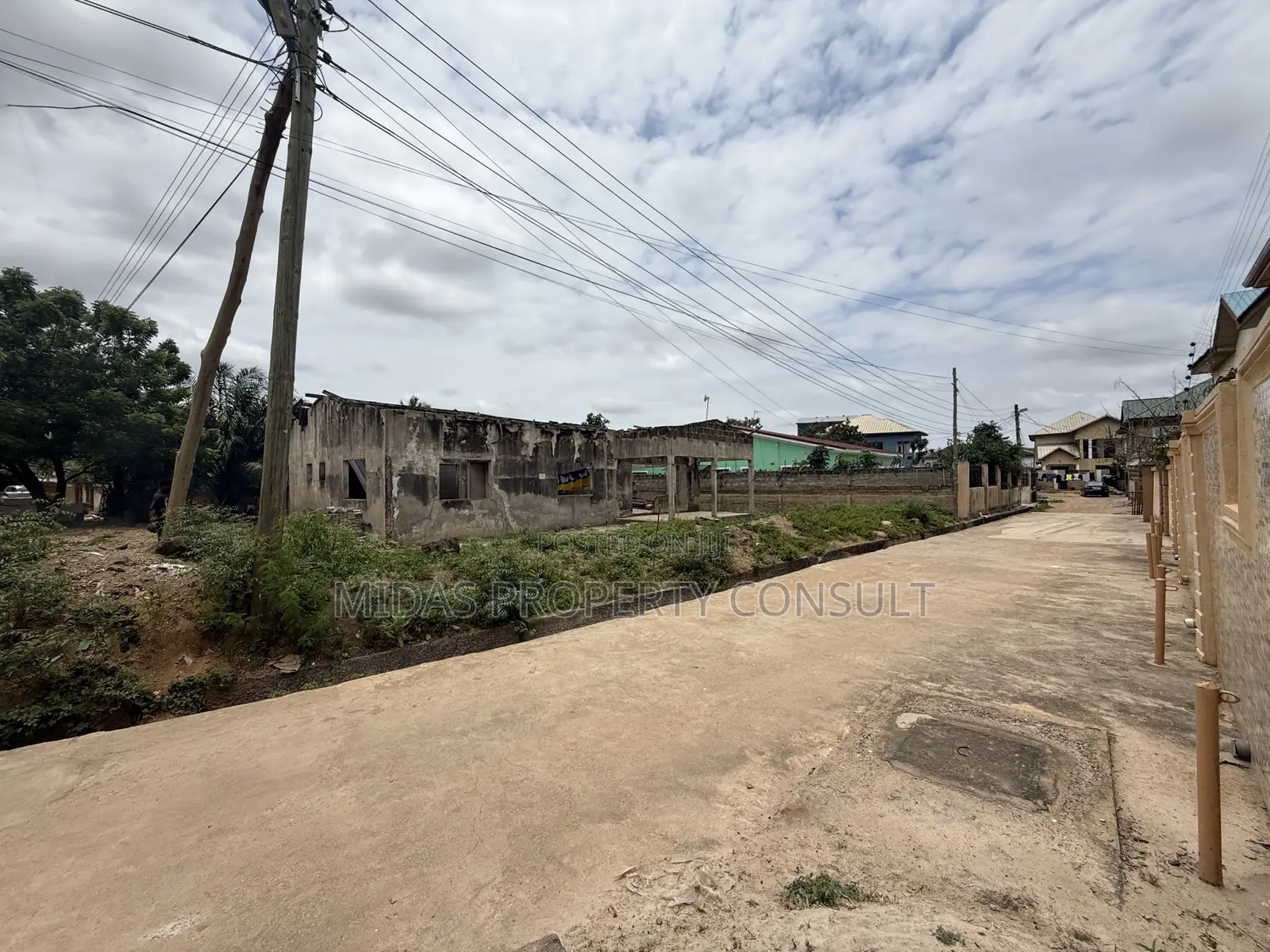 A Plot of Titled Land for Sale at Spintex With an Old Structure
