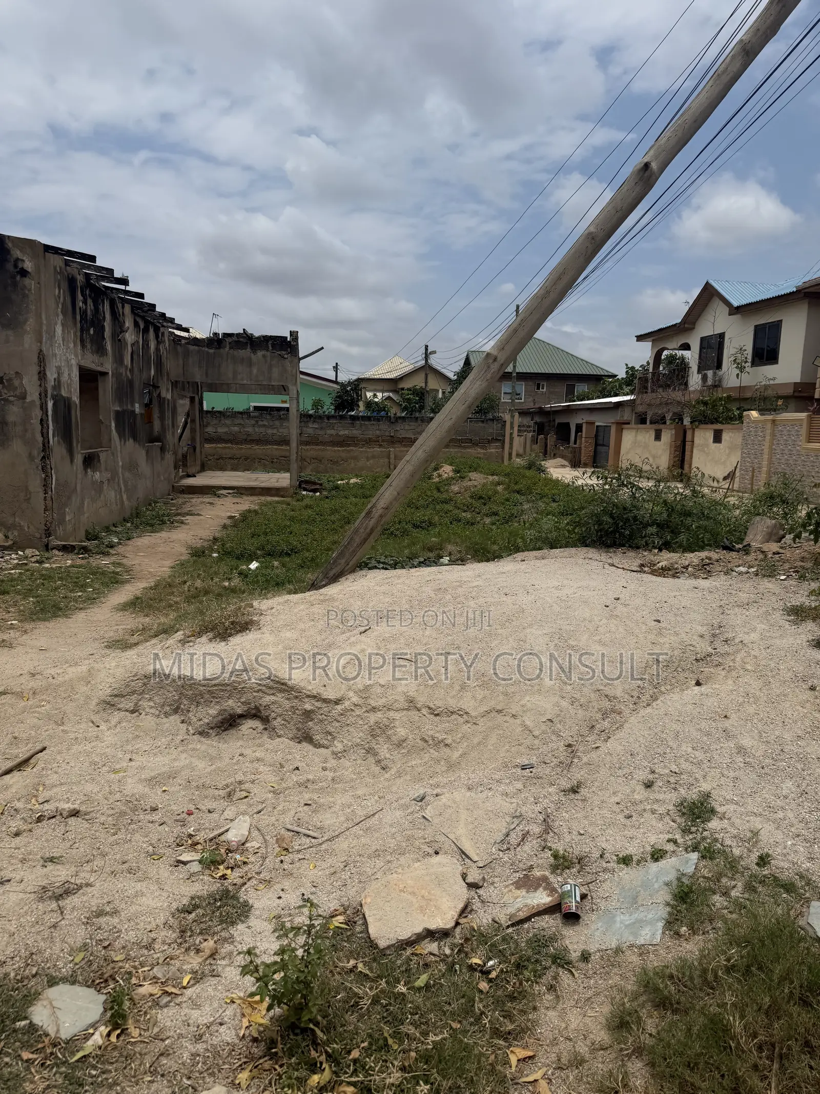 A Plot of Titled Land for Sale at Spintex With an Old Structure
