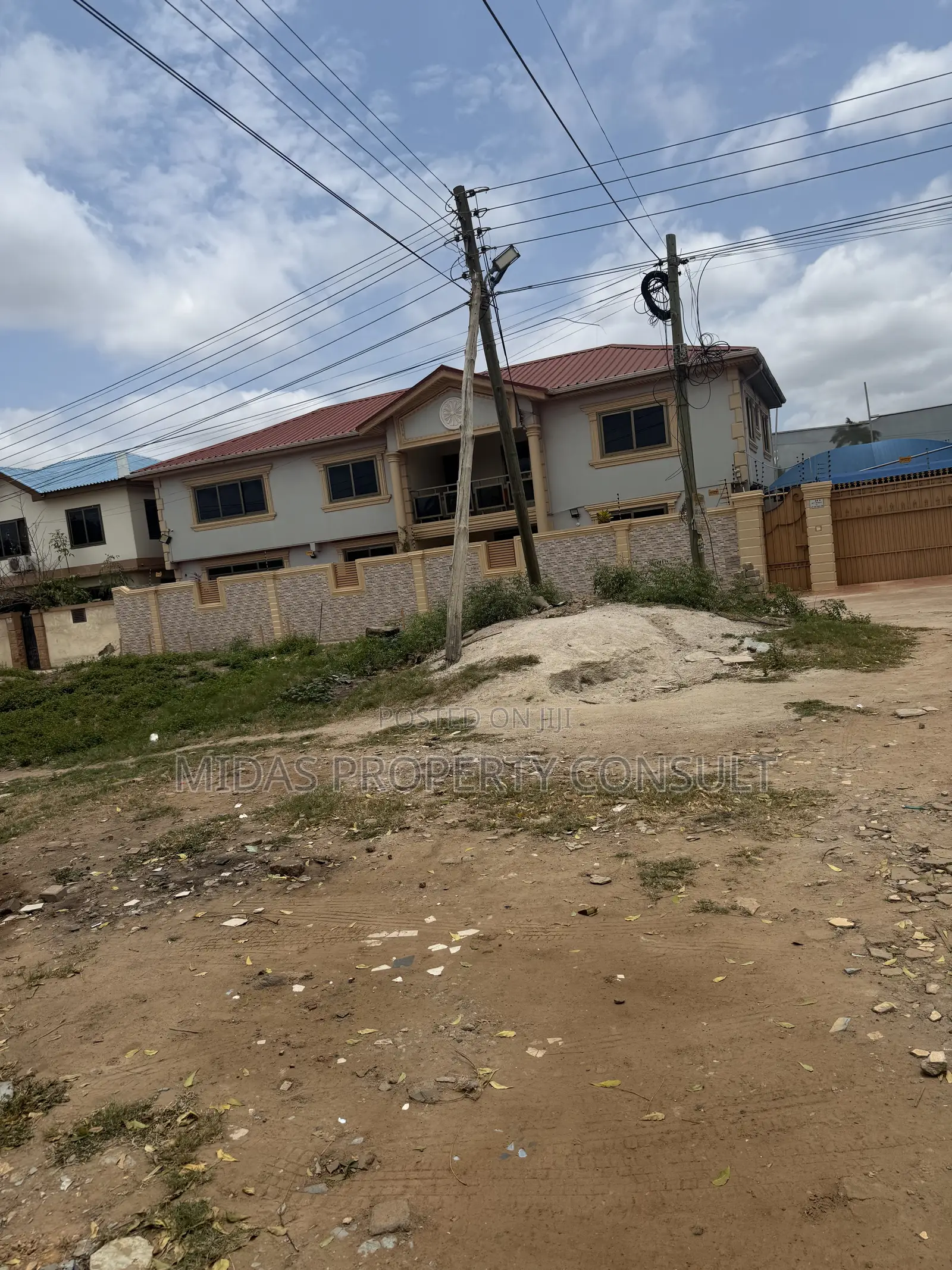 A Plot of Titled Land for Sale at Spintex With an Old Structure