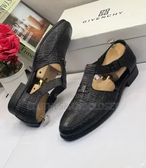 A Pair of Black Embossed Leather Monk-Strap Shoe-Sandals