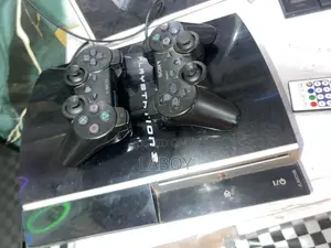 PS3 Standard With Two Controllers and 5games