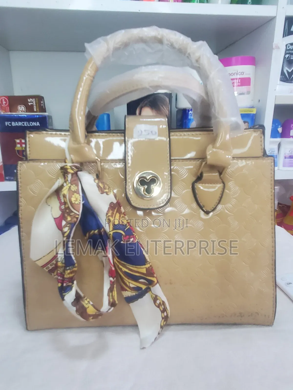 Beige Embossed Patent Leather Top-Handle Handbag With Scarf.