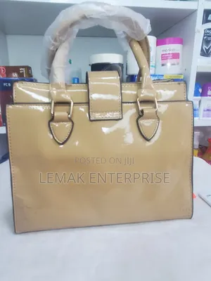 Beige Embossed Patent Leather Top-Handle Handbag With Scarf.