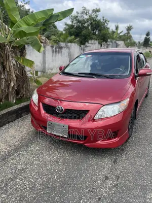 Toyota Corolla Base 4dr Sedan (1.8L 4cyl 5M) 2010 Red