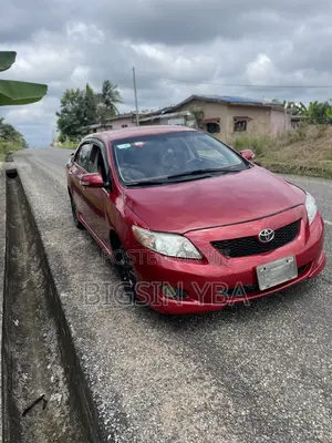 Toyota Corolla Base 4dr Sedan (1.8L 4cyl 5M) 2010 Red