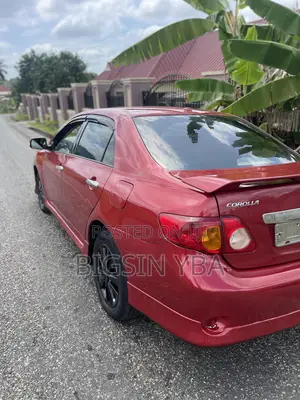 Toyota Corolla Base 4dr Sedan (1.8L 4cyl 5M) 2010 Red