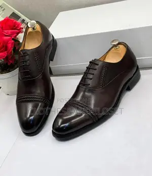 Polished Dark Brown Leather Oxfords Feature a Braided Cap-Toe Detail.