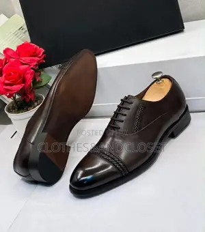 Polished Dark Brown Leather Oxfords Feature a Braided Cap-Toe Detail.