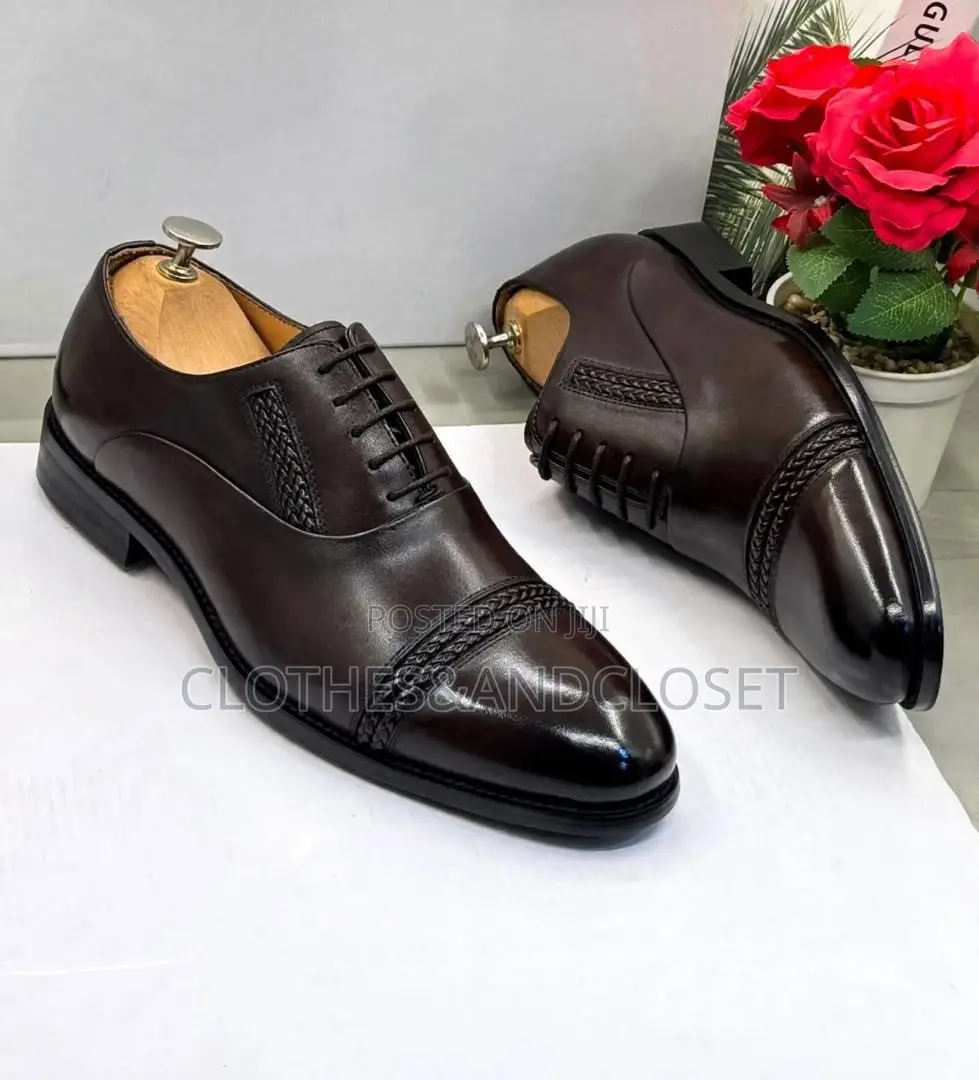 Polished Dark Brown Leather Oxfords Feature a Braided Cap-Toe Detail.