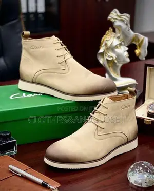 Tan Clarks Chukka Boots Feature a Stylish Burnished Gradient Toe