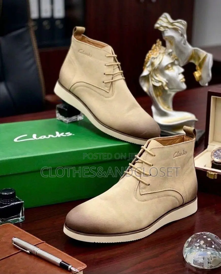 Tan Clarks Chukka Boots Feature a Stylish Burnished Gradient Toe