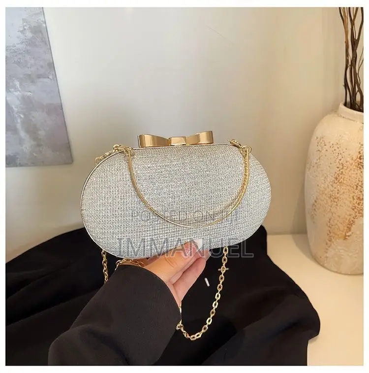 Ladies Cute Oval Clutch Bags