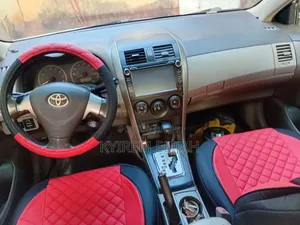 Toyota Corolla Base 4dr Sedan (1.8L 4cyl 5M) 2010 White
