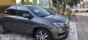 Honda Pilot Touring 4dr SUV 4WD (3.5L 6cyl 9A) 2017 Gray