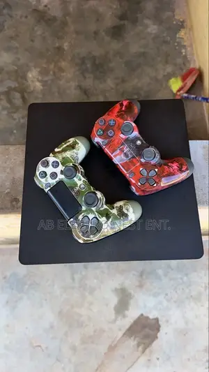 Neat PS4 Slim With 2 Controllers Plus Games