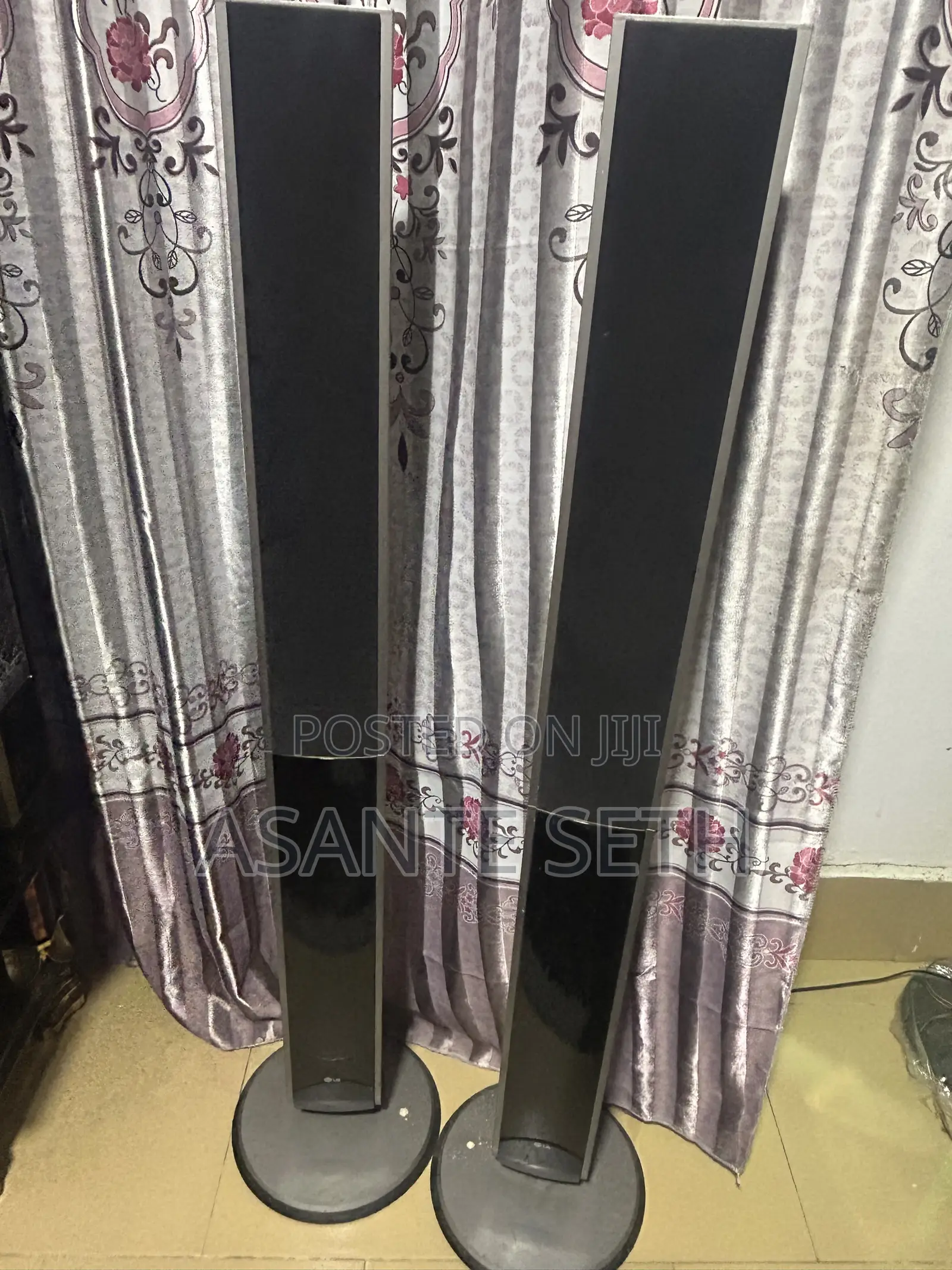 LG Two Stand Poles Surrounding Speakers for Cool Price