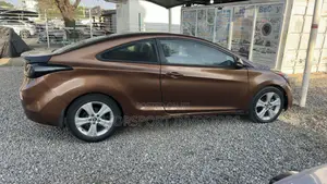 Hyundai Elantra GS Coupe FWD (1.8L 4cyl 6A) 2013 Brown
