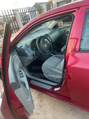 Toyota Corolla Base 4dr Sedan (1.8L 4cyl 5M) 2010 Red