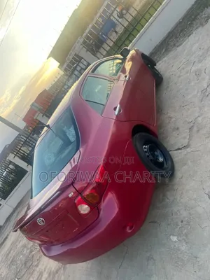 Toyota Corolla Base 4dr Sedan (1.8L 4cyl 5M) 2010 Red
