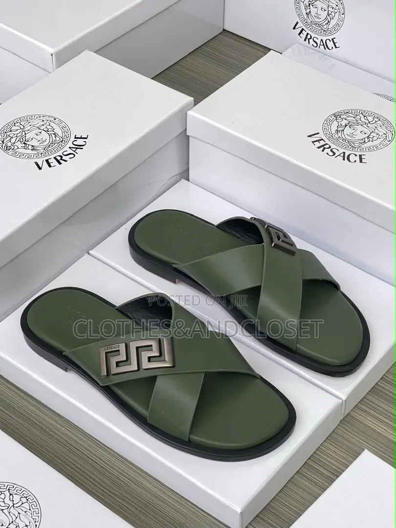 Stylish Black Leather Slides Feature a Striking Cross-Strap Desig