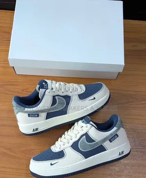 The Nike Air Force 1 X Dior Sneakers White and Navy Blue Colorway.