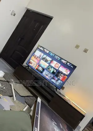 Brand New 50’ TV and Wooden Stand for Sale
