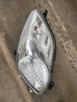 Toyota Vitz 2010 Headlight With Booster