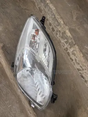 Toyota Vitz 2010 Headlight With Booster