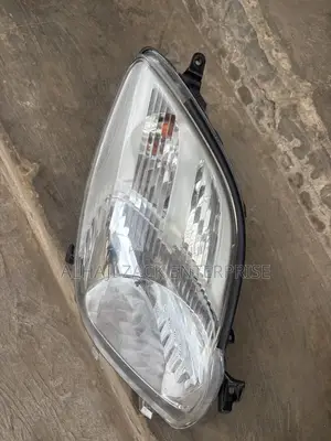 Toyota Vitz 2010 Headlight With Booster
