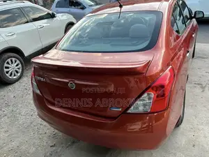 Nissan Versa 1.6 S 4dr Sedan (1.6L 4cyl 4A) 2014 Orange