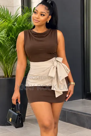 Bodycon Sleeveless Mini Dress With a Cream Wrap-Style Waist Sash.