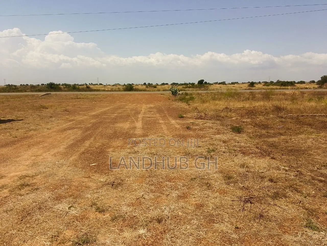 Land by Roadside.100 Acres.Titled.Developed Area(Tsopoli)