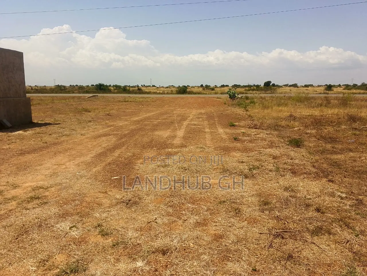 Land by Roadside.100 Acres.Titled.Developed Area(Tsopoli)