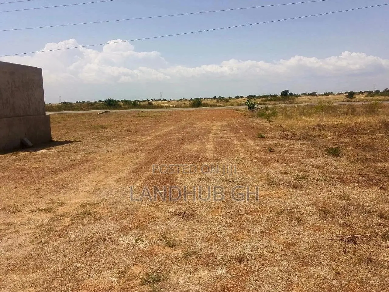 Land by Roadside.100 Acres.Titled.Developed Area(Tsopoli)