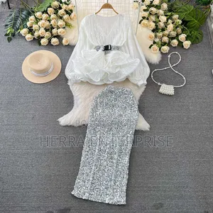 Elegant Two-Piece Outfit Features a White v-Neck Pleated Ruffle Blouse