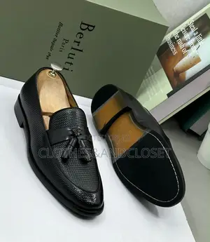 S a Pair of Black Textured Leather Tassel Loafers on Wooden Shoe Trees