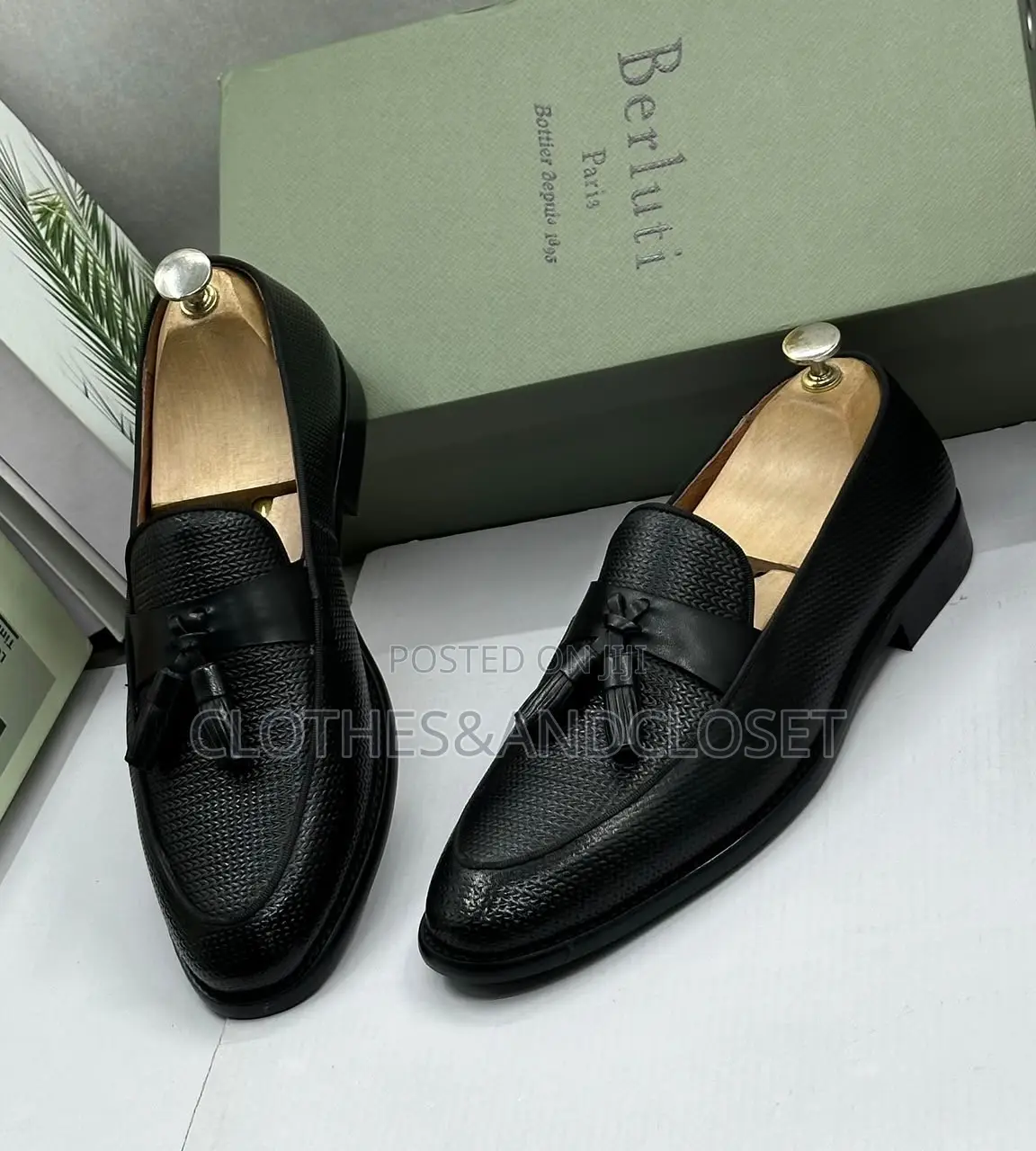 S a Pair of Black Textured Leather Tassel Loafers on Wooden Shoe Trees