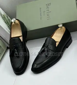 S a Pair of Black Textured Leather Tassel Loafers on Wooden Shoe Trees