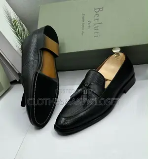 S a Pair of Black Textured Leather Tassel Loafers on Wooden Shoe Trees
