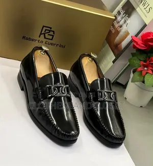 Black Mirror Leather Loafers Featuring a Metallic Ornament