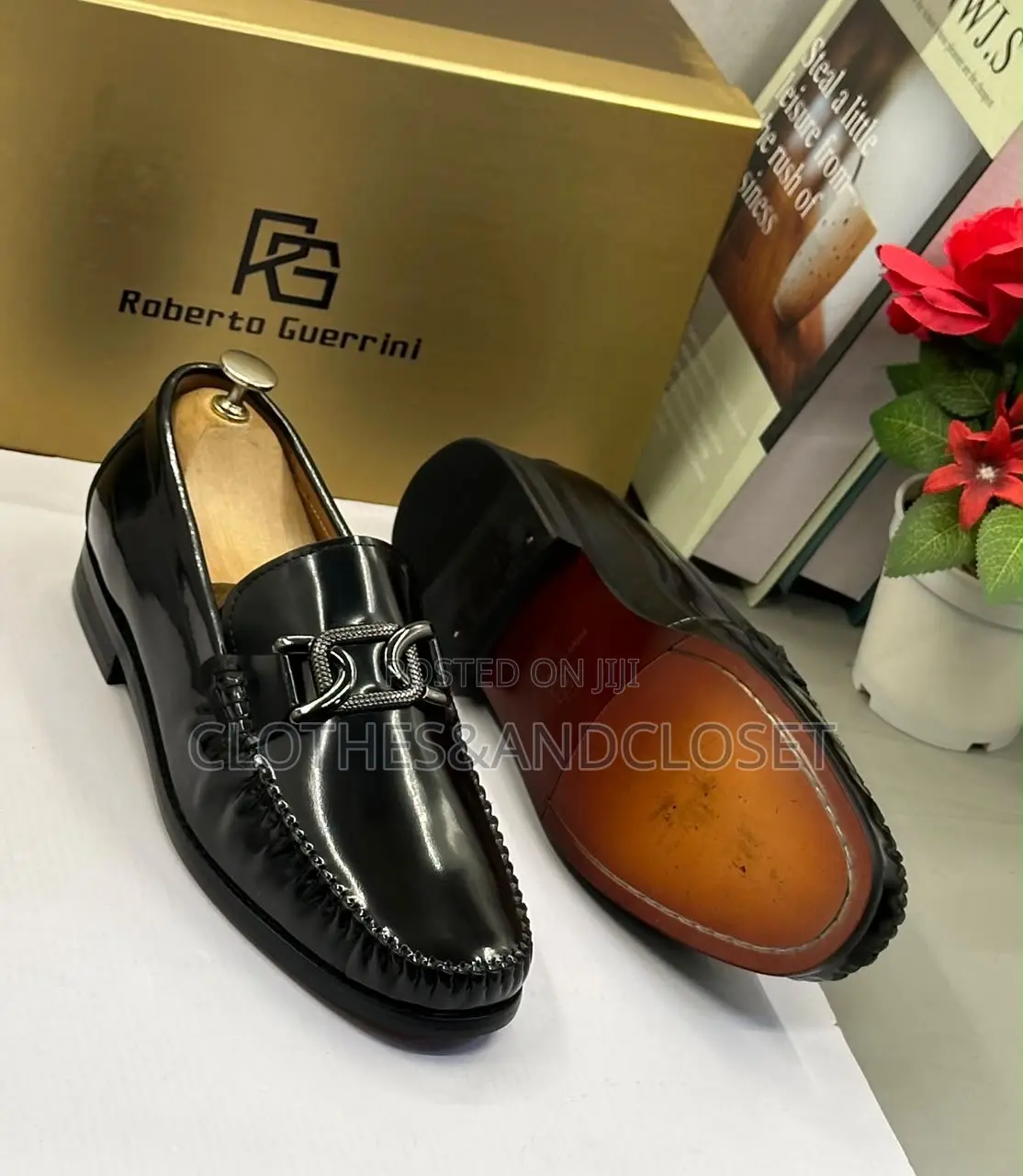 Black Mirror Leather Loafers Featuring a Metallic Ornament