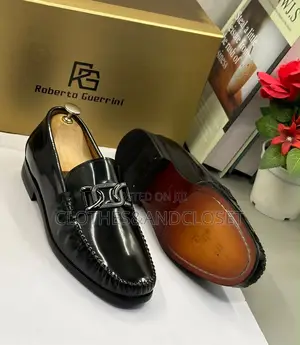 Black Mirror Leather Loafers Featuring a Metallic Ornament