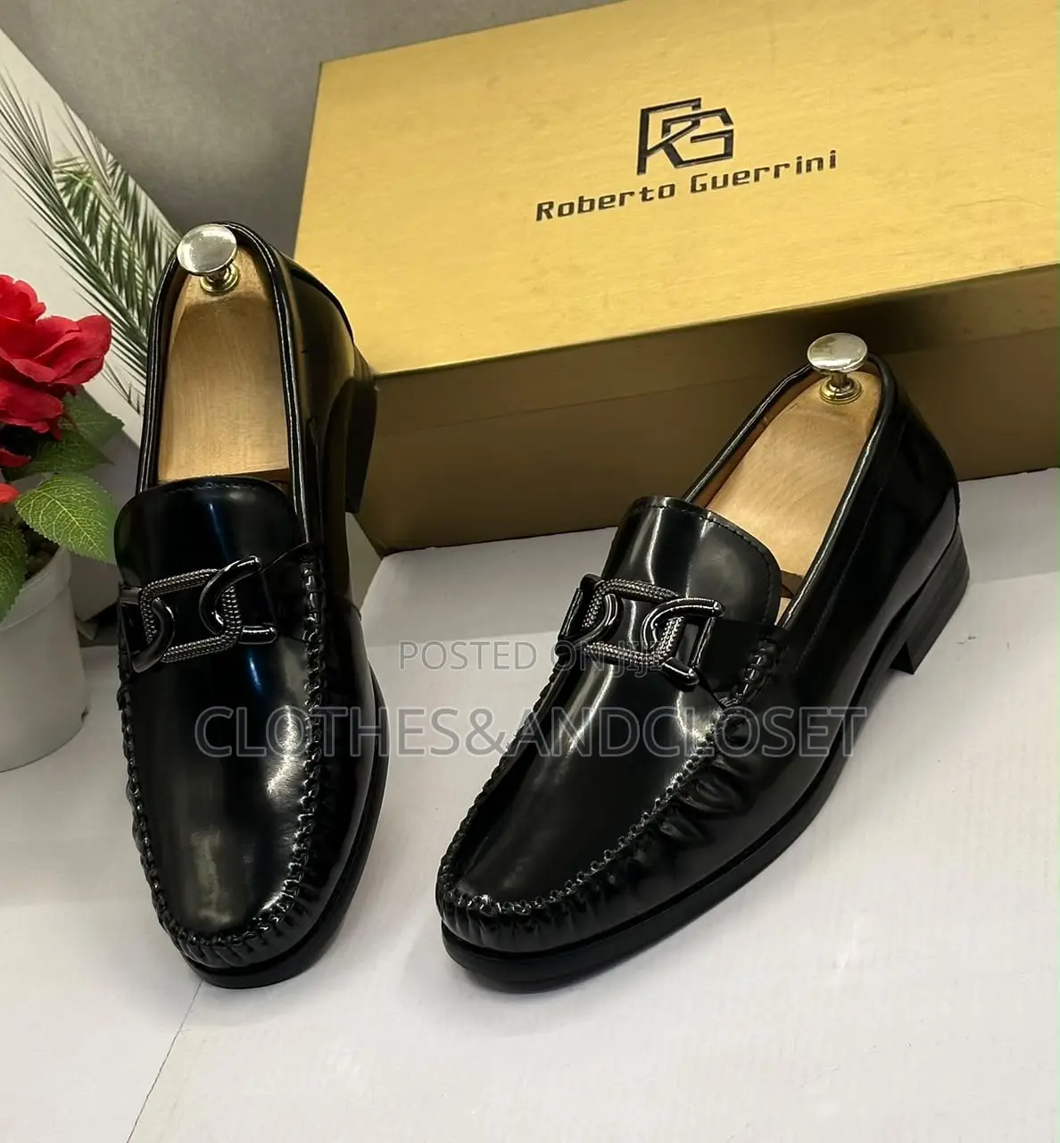 Black Mirror Leather Loafers Featuring a Metallic Ornament