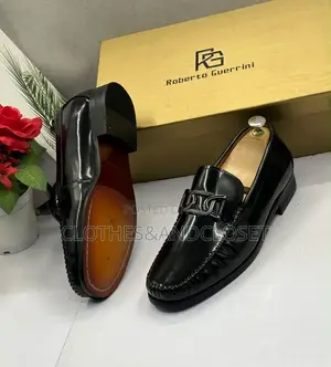 Black Mirror Leather Loafers Featuring a Metallic Ornament