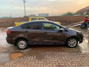 Kia Rio LX 4dr Sedan (1.6L 4cyl 6M) 2013 Brown