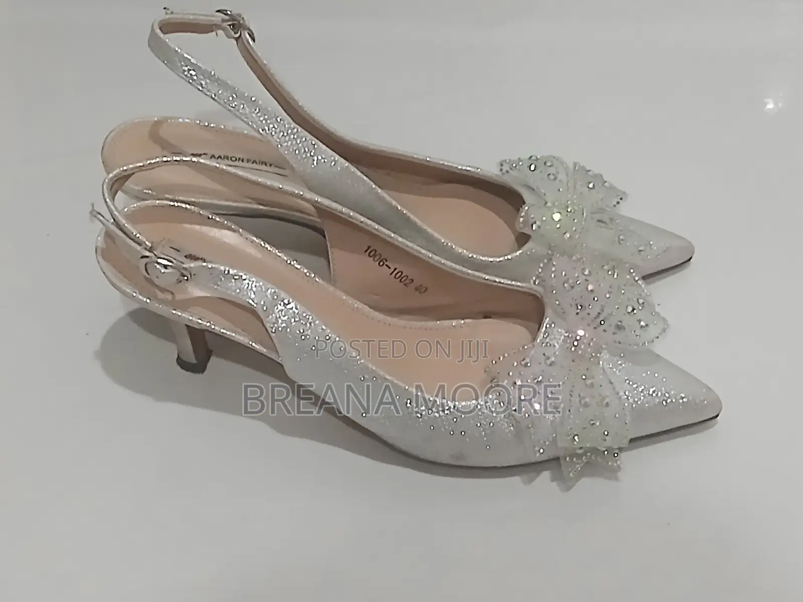 AARON FAIRY Silver Shimmer Slingback Heels With Rhinestone Bow