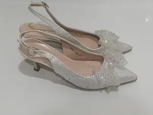 AARON FAIRY Silver Shimmer Slingback Heels With Rhinestone Bow
