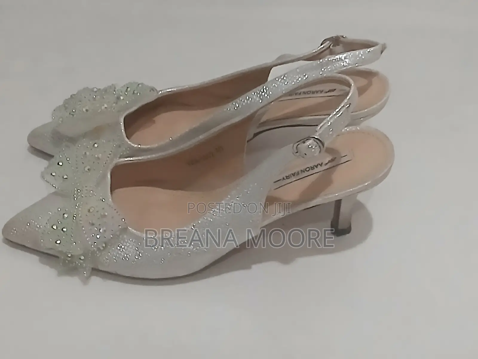 AARON FAIRY Silver Shimmer Slingback Heels With Rhinestone Bow